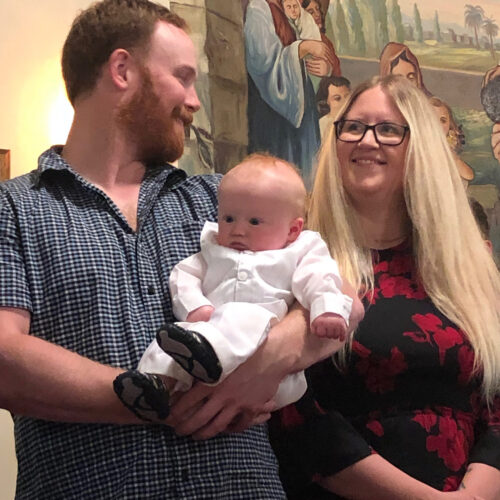 Husband and wife with baby boy waiting for Babtism